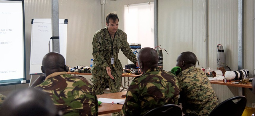U.S. Navy Explosive Ordnance Disposal 1st Class Tyler Brooks, Task Force Sparta, teaches how to identify and counter improvised explosive devices to participants from African Union Mission in Somalia troop contributing countries in 2016.