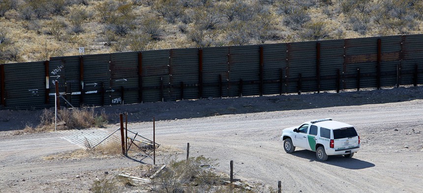 A Border Patrol vehicle secures border fence line in Arizona in 2011.