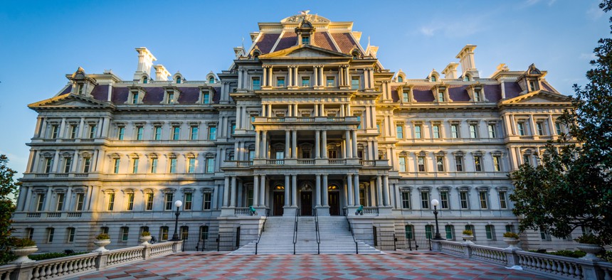 The Eisenhower Executive Office Building at dusk.