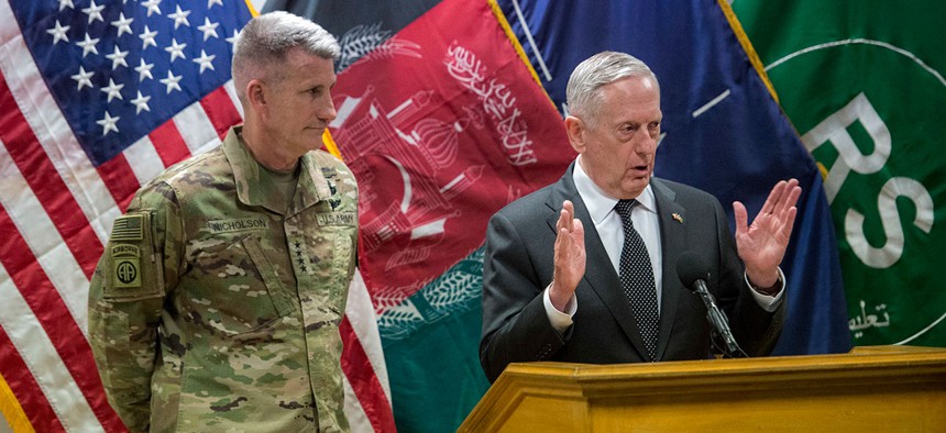 Defense Secretary Jim Mattis speaks to reporters from Resolute Support headquarters in Kabul, Afghanistan, as Gen. John Nicholson stands behind Mattis on April 24, 2017.