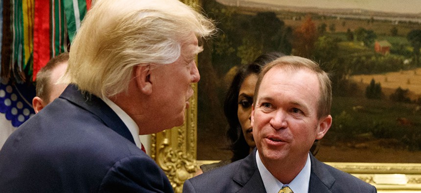 President Donald Trump talks with Office of Management and Budget Director Mick Mulvaney in February in the White House.