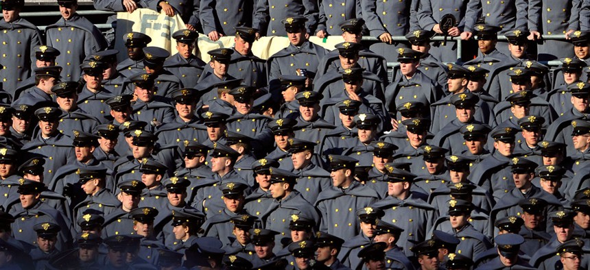 Army cadets look on as their team falters afield during the annual Navy vs. Army college football in 2011