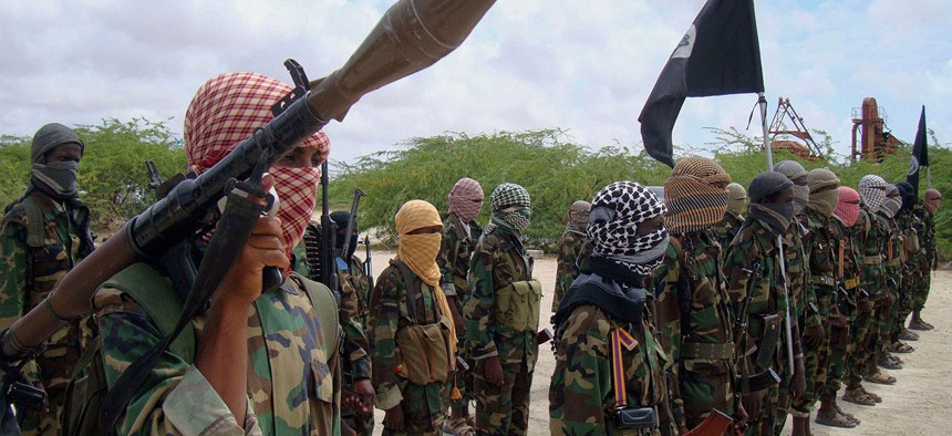 Al-Shabaab fighters display weapons as they conduct military exercises in northern Mogadishu, Somalia. 