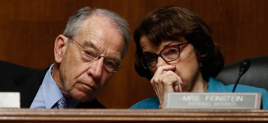 Senate Judiciary Committee Chairman Sen. Charles Grassley, R-Iowa talks with the committee's ranking member Sen. Dianne Feinstein, D-Calif. on Capitol Hill on May 3.