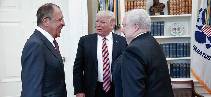 President Donald Trump meets with Russian Foreign Minister Sergey Lavrov, left, next to Russian Ambassador to the U.S. Sergei Kislyak at the White House in Washington, Wednesday, May 10.