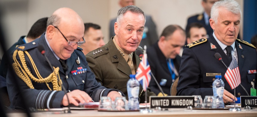 Gen. Joseph Dunford, chairman of the Joint Chiefs of Staff, meets with his counterparts during a NATO Military Committee in Chiefs of Defense session in Brussels.