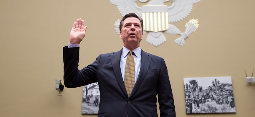 James Comey is sworn in on Capitol Hill in Washington, Thursday, July 7, 2016, prior to testifying before the House Oversight and Government Reform Committee.
