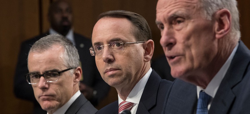 Acting FBI Director Andrew McCabe, Deputy Attorney General Rod Rosenstein, and Director of National Intelligence Dan Coats, testify before a Senate Intelligence Committee hearing about the Foreign Intelligence Surveillance Act on Wednesday.