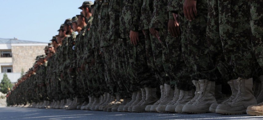 Afghan National Army recruits stand in formation during their graduation ceremony at the Kabul Military Training Center Sept. 22, 2011