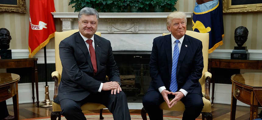 Donald Trump meets with Ukrainian President Petro Poroshenko in the Oval Office of the White House, Tuesday, June 20.