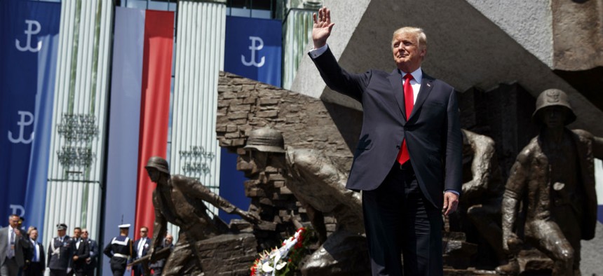 President Donald Trump waves as he arrives to deliver a speech at Krasinski Square at the Royal Castle on July 6.