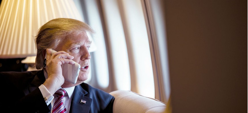 President Donald Trump speaks on the phone from Air Force One.