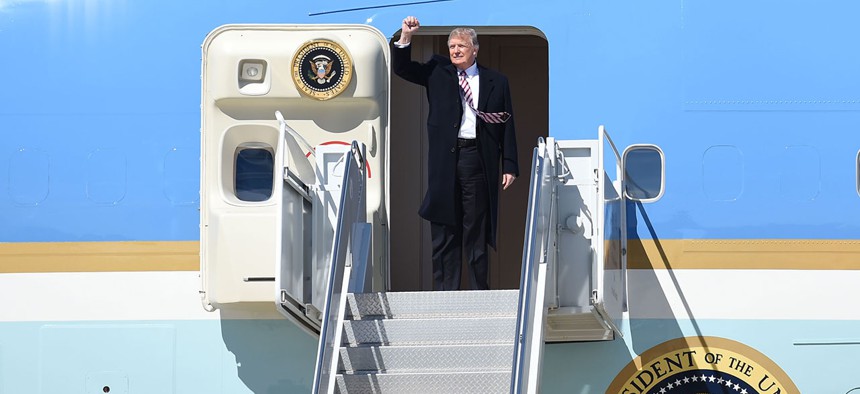 Trump exits Air Force One in March.