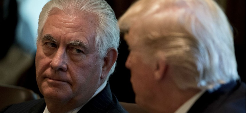Secretary of State Rex Tillerson listens as President Donald Trump speaks during a Cabinet meeting in June.
