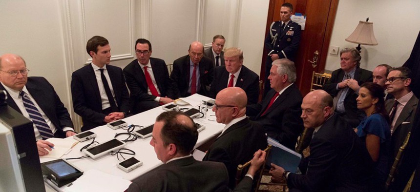 Donald Trump is shown in an official White House handout image meeting with his National Security team.