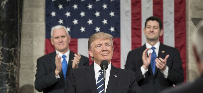 Flanked by Vice President Mike Pence and Speaker of the House Paul Ryan, President Donald Trump delivers his Joint Address to Congress in February.