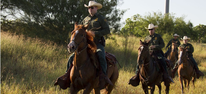 Agents patrol on horseback in South Texas. The IG said wastefulness could hinder CBP's planned Border Patrol hiring spree. 