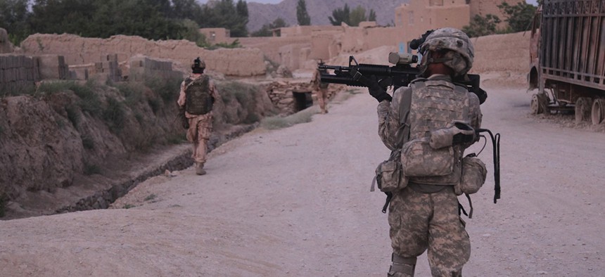U.S. Army Sgt. 1st Class Walter Taylor, 541st Sapper Co., 54th Engineer Battalion, 18th Engineer Brigade, provides security while his team bounds forward, at Baraki Barak, Logar province, Afghanistan in 2011.