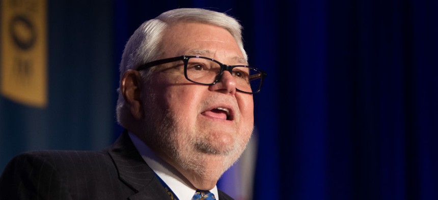 Executive alleges his removal was the result of his criticism of the leadership of AFGE President J. David Cox. 