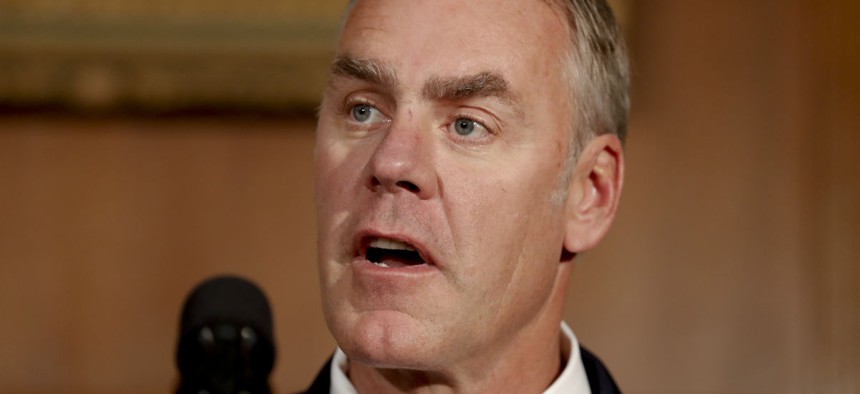The Interior Department under Secretary Ryan Zinke has reassigned about 50 of its senior executives.