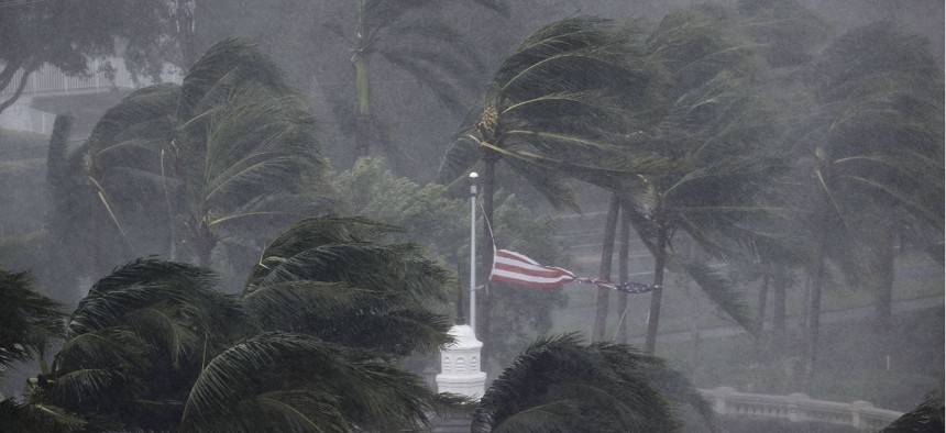 An American flag is torn as Hurricane Irma passes through Naples, Fla., Sunday, Sept. 10.