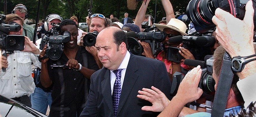 Mathew Cooper, center, leaves U. S. District Court in Washington Wednesday, July 6, 2005, after agreeing to cooperate with federal prosecutor's investigation into the leak of the identity of CIA operative Valerie Plame. 
