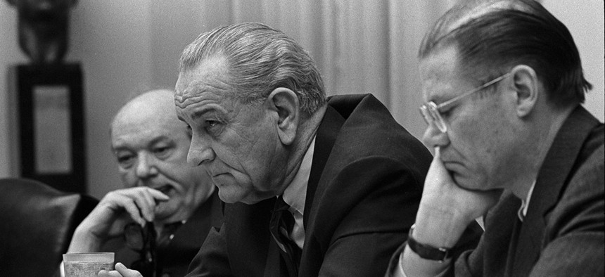 Secretary of State Dean Rusk, President Lyndon Johnson and Secretary of Defense Robert McNamara.  