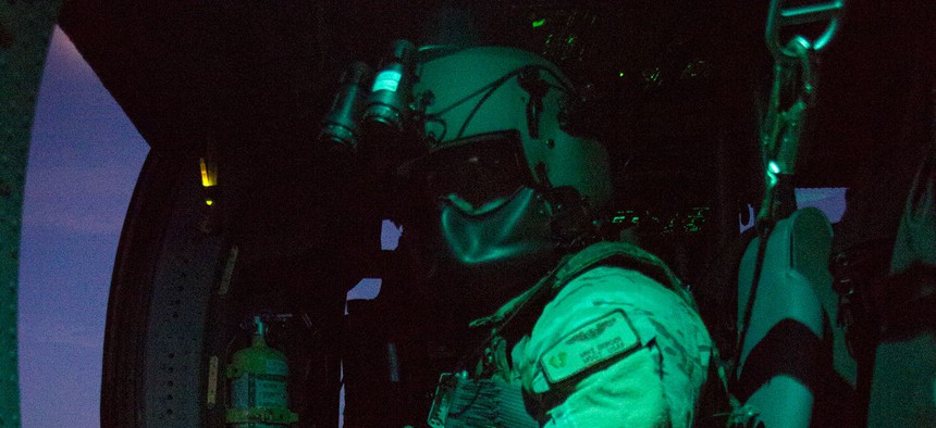 Master Sgt. Michael Berger, a special mission aviator from the 920th Rescue Wing, prepares for takeoff prior to a night flight on an HH-60G Pave Hawk helicopter July 6, 2017. The night exercise included a two-ship formation.