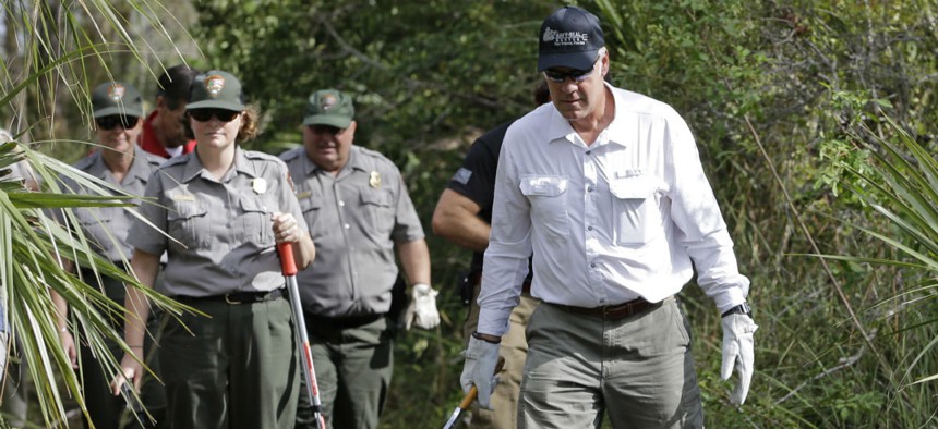 Interior Secretary Ryan Zinke gets a tour from National Park Service employees at Big Cypress National Preserve in Florida, during a three-day trip to assess hurricane damage. 