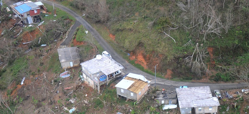 Wrecked houses are shown in Jayuya, Puerto Rico on Saturday.