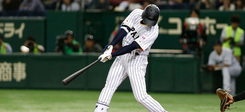 Japanese baseball player Shohei Otani hits a home run during an exhibition in 2016.