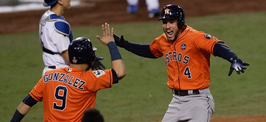 George Springer and Marwin González celebrate after Springer's home run Thursday night.