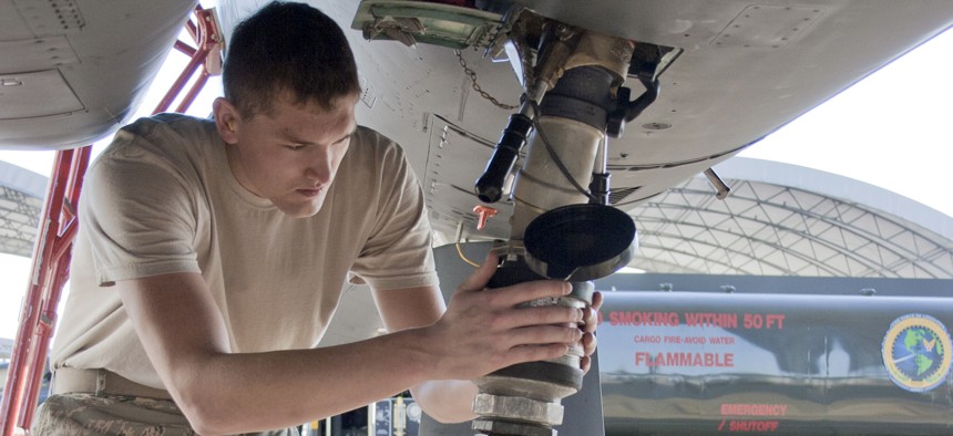 Senior Airman Jacob Prine checks the fuel connection to a F-15 Eagle in 2010. 