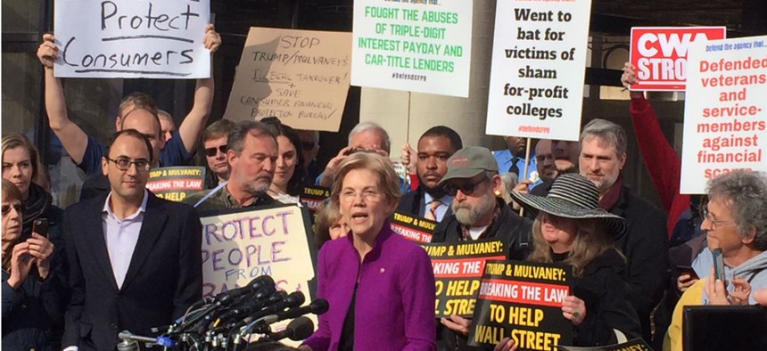 Sen. Elizabeth Warren, D-Mass., spoke to a crowd of protesters outside CFPB headquarters on Tuesday before the court ruled.