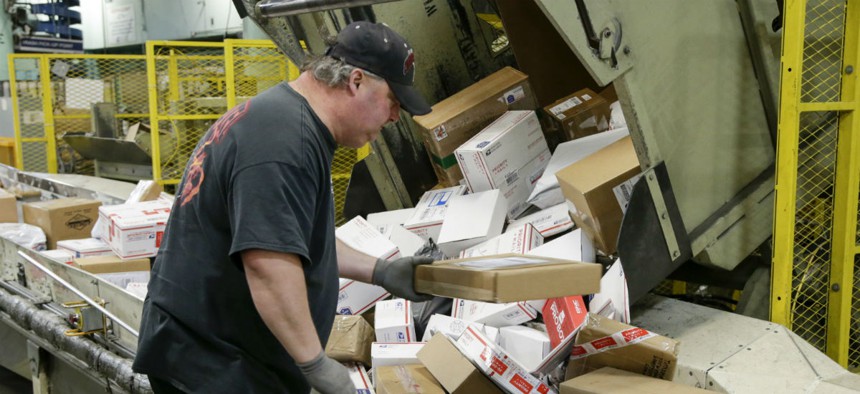 Packages are arranged at the main post office in Omaha, Neb., during the holidays. USPS was Americans' favorite federal agency on a recent poll. 