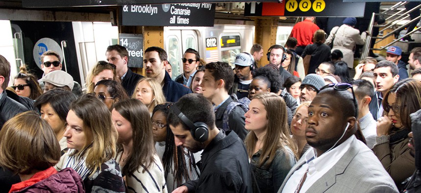 Commuters crowd a platform after exiting the L train in the Union Square subway station in New York in May.