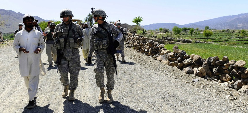 U.S. Navy engineers talk to Afghan officials in Khost Province, Afghanistan.