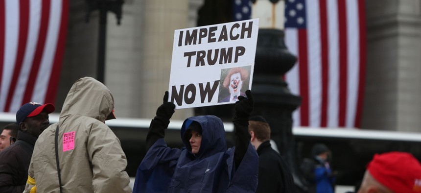 A protestor shows a sign during a rally in D.C. in 2017.