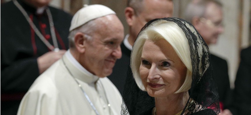 U.S. Ambassador to the Holy See Callista Gingrich walks past Pope Francis during an audience on Jan. 8. Trump is behind Obama in filling overseas posts.