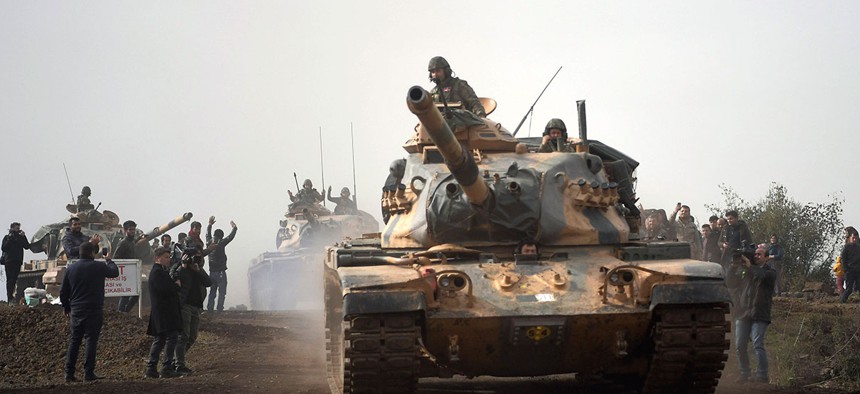 Turkish army tanks leaving Hassa, Hatay, Turkey, and heading for Afrin, an enclave in northern Syria controlled by U.S.-allied Kurdish fighters, on Jan. 22, 2018.