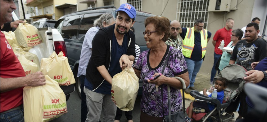Actor and composer of Puerto Rican descent Lin-Manuel Miranda distributes food to victims of Hurricane Maria in November.