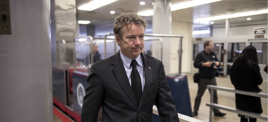 Sen. Rand Paul, R-Ky., sought to delay voting over his opposition to raising the spending caps on agencies.