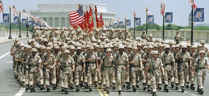 Troops march across the Memorial Bridge towards the Pentagon during 1991 National Victory Celebration Parade in Washington. It was the largest U.S. military parade since World War II. 