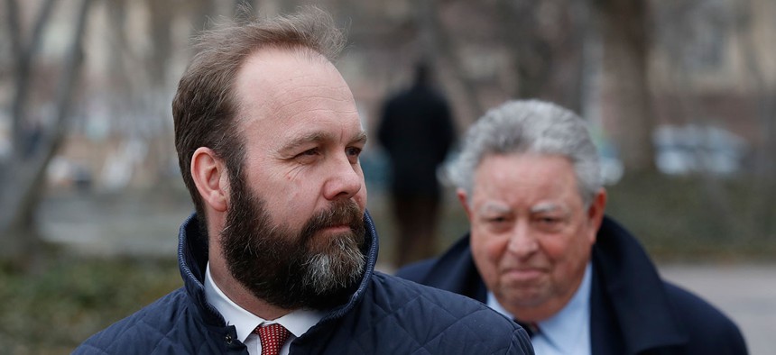 Rick Gates, left, with his lawyer Tom Green, depart Federal District Court, Wednesday, Feb. 14, in Washington.