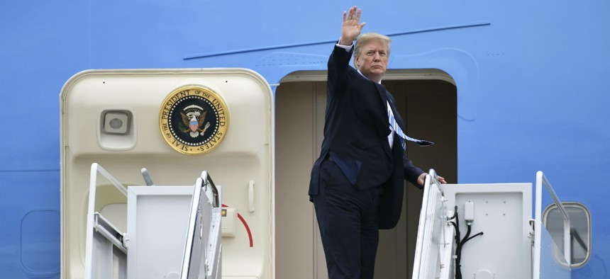 President Trump waves from the steps of Air Force One as he leaves for Mar-a-Lago earlier this month. 