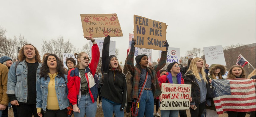 High school students from across the Washington area protest gun control laws and gun reform in front of the White House on Feb. 19.