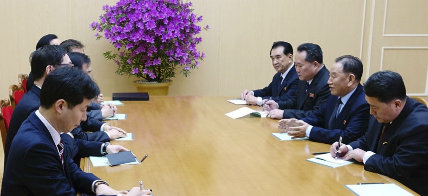 Kim Yong Chol, vice chairman of North Korea's ruling Workers' Party Central Committee, second from right, talks with the South Korean delegation in Pyongyang, North Korea, on Monday.