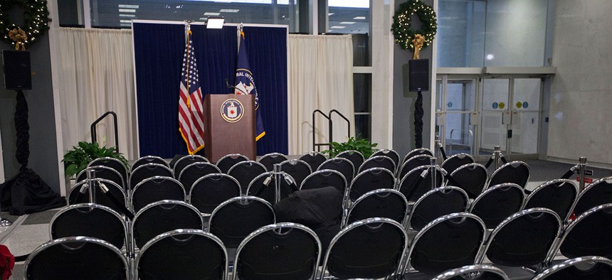 The stage podium and chairs are seen set up before the start of CIA Director John Brennan's news conference at CIA headquarters in 2014.