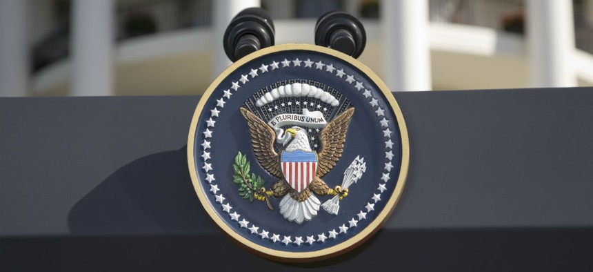 The presidential seal on a podium outside the White House. 