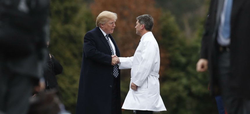 President Trump shakes hands with White House physician Dr. Ronny Jackson as he boards Marine One on Jan. 12, 2018, after his first medical check-up as president. 